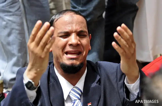 An Egyptian protester attends the weekly Muslim Friday prayers at Tahrir Square in Cairo, Egypt Friday, May 27, 2011. Thousands of protesters poured into downtown Cairo's Tahrir Square Friday for what they called a 'seco...