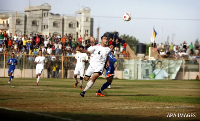 Palestinian Shabab Rafah player vies with Al-Shatea soccer club player during Gaza Strip league, in the southern Gaza Strip town Rafah on May 27,2011. The match ended 0-0.. Photo by Ali Jadallah
