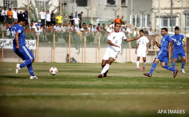 Palestinian Shabab Rafah player vies with Al-Shatea soccer club player during Gaza Strip league, in the southern Gaza Strip town Rafah on May 27,2011. The match ended 0-0.. Photo by Ali Jadallah