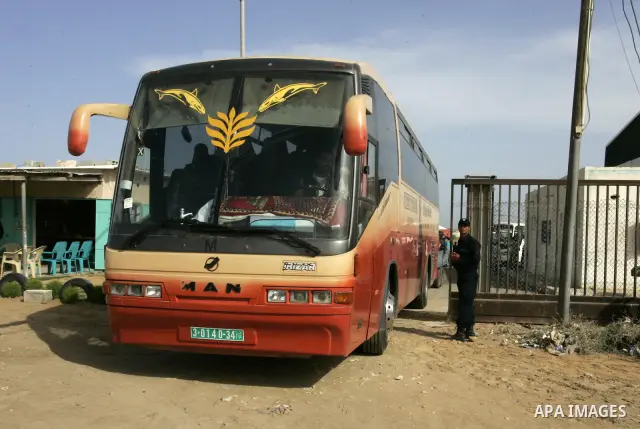 Palestinians sit in a bus as they wait to cross into Egypt through the Rafah border crossing in the southern Gaza Strip on May 28, 2011 as Egypt reopened the border, allowing people to cross freely for the first time in...