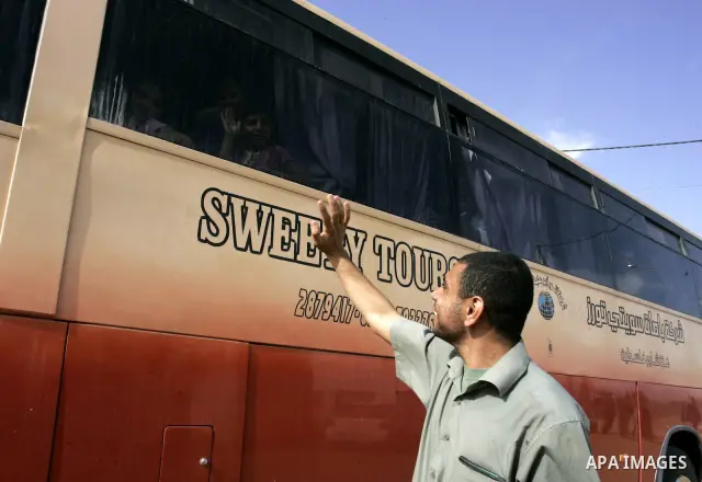 Palestinians sit in a bus as they wait to cross into Egypt through the Rafah border crossing in the southern Gaza Strip on May 28, 2011 as Egypt reopened the border, allowing people to cross freely for the first time in...