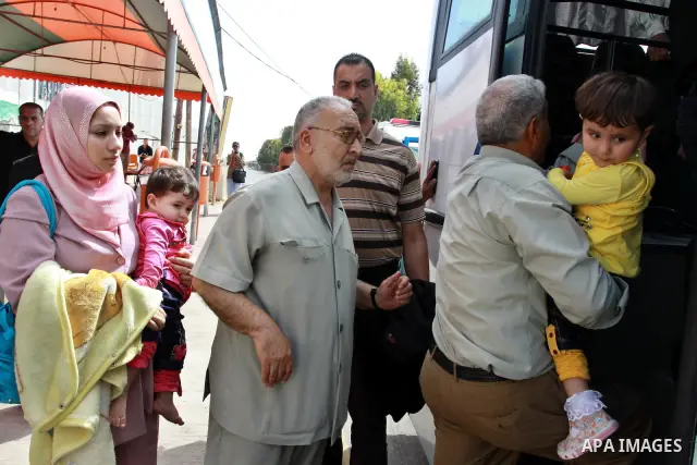 Palestinian boarding the bus to cross into Egypt through the Rafah border crossing in the southern Gaza Strip on May 28, 2011 as Egypt reopened the border, allowing people to cross freely for the first time in four years...