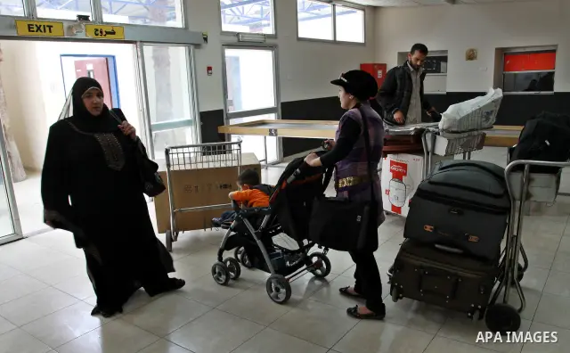 Palestinians returnees come through the Rafah border crossing in the southern Gaza Strip on May 28, 2011 as Egypt reopened the border, allowing people to cross freely for the first time in four years. Photo by Naaman Oma...