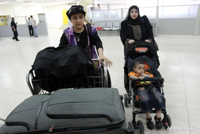 Palestinians returnees come through the Rafah border crossing in the southern Gaza Strip on May 28, 2011 as Egypt reopened the border, allowing people to cross freely for the first time in four years. Photo by Naaman Oma...
