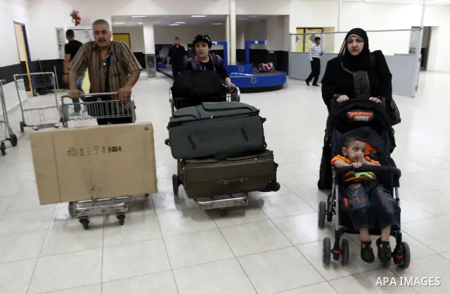Palestinians returnees come through the Rafah border crossing in the southern Gaza Strip on May 28, 2011 as Egypt reopened the border, allowing people to cross freely for the first time in four years. Photo by Naaman Oma...