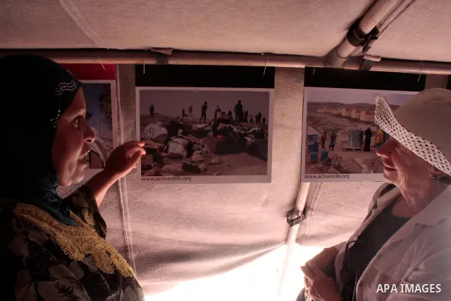 Palestinian, left-wing Israeli and foreign peace activists take part in the opening of the Susiya Creative and Learning Center in the mountains in the area of Yatta village close to the Jewish settlement of Sosia south o...