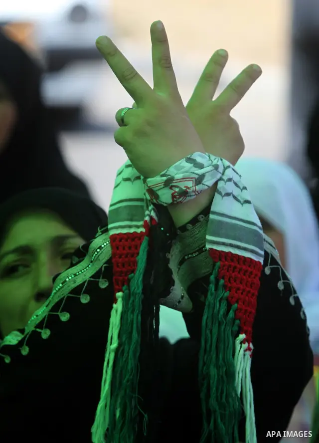 Palestinians women hold pictures of jailed relatives during a protest calling for their release from Israeli prisons near Erez crossing between Israel and the northern Gaza Strip on May 28, 2011. Photo by Yasser Fathi