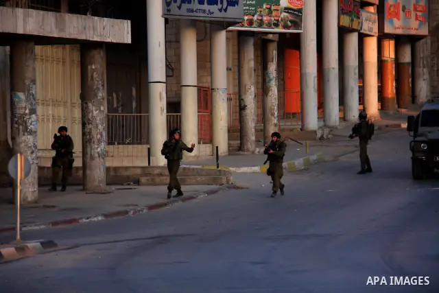 Israeli soldiers take a positions during clashes with Palestinians after Jews pray at the biblical Joseph's Tomb in the West Bank city of Nablus early on May 30, 2011. Photo by Wagdi Eshtayah