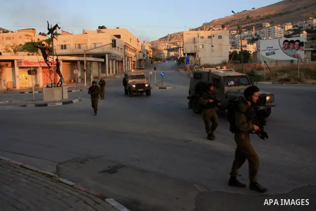 Israeli soldiers take a positions during clashes with Palestinians after Jews pray at the biblical Joseph's Tomb in the West Bank city of Nablus early on May 30, 2011. Photo by Wagdi Eshtayah