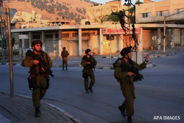 Israeli soldiers take a positions during clashes with Palestinians after Jews pray at the biblical Joseph's Tomb in the West Bank city of Nablus early on May 30, 2011. Photo by Wagdi Eshtayah