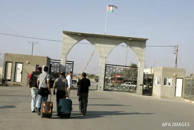 Palestinians load their luggage as they wait to cross into Egypt through the Rafah border crossing in the southern Gaza Strip on May 30, 2011. Egypt eased travel restrictions for residents of Gaza from Saturday, and erod...