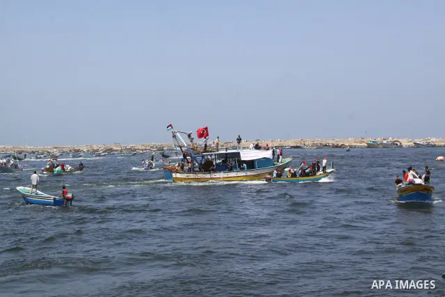 Palestinians ride boats in the Mediterranean Sea off the coast of Gaza City May 30, 2011, during a rally marking the first anniversary of the death of nine Turks, who were shot dead last May when Israeli naval commandos...
