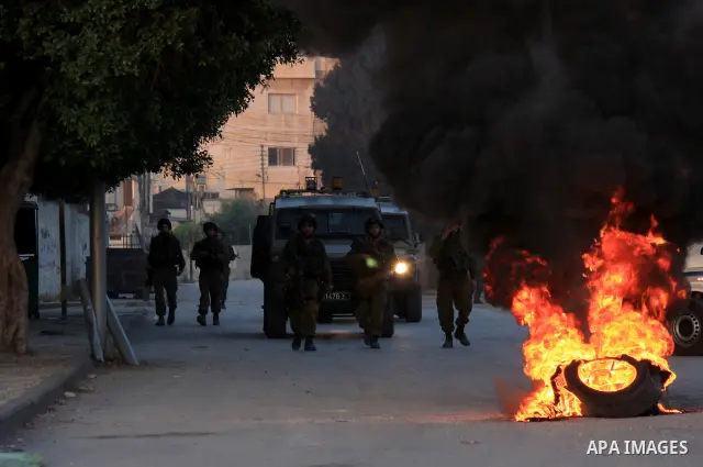 Israeli soldiers take a positions during clashes with Palestinians after Jews pray at the biblical Joseph's Tomb in the West Bank city of Nablus on May 30, 2011. Photo by Wagdi Eshtayah