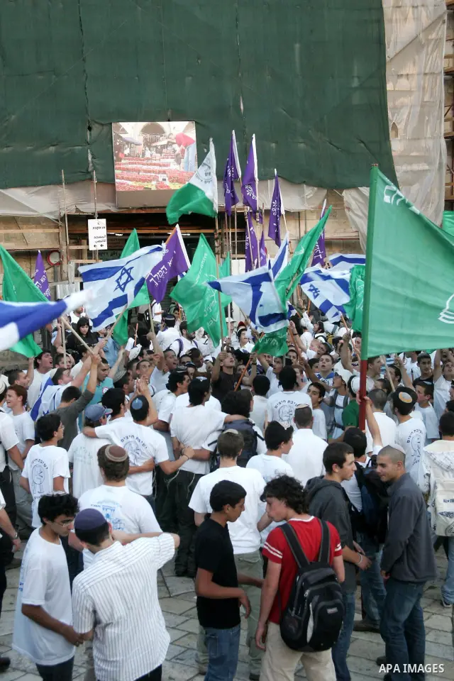 Israelis march at Damascus Gate, the main entrance to the old city of Jerusalem on June 1, 2011 as some 40,000 Jewish Israelis joined a Jerusalem Day parade in the city's mainly Arab eastern sector to celebrate its captu...