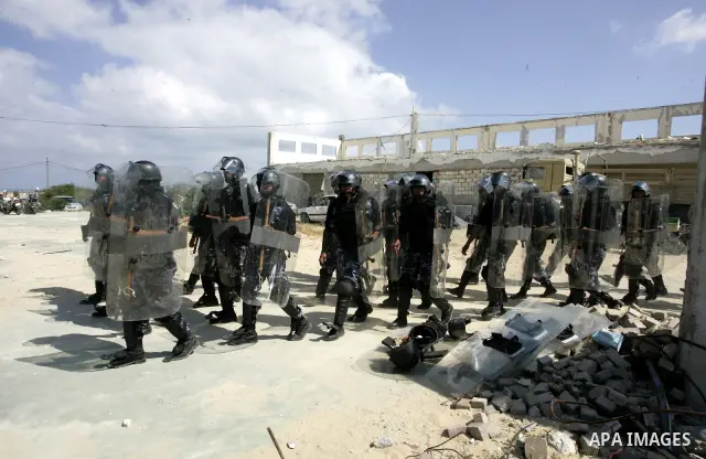 Palestinian Hamas security forces march during a graduation ceremony in the southern Gaza Strip town of Khan Yunis on 02 June 2011. The release of the captured soldier Versus for a thousand Palestinian prisoners . Said n...