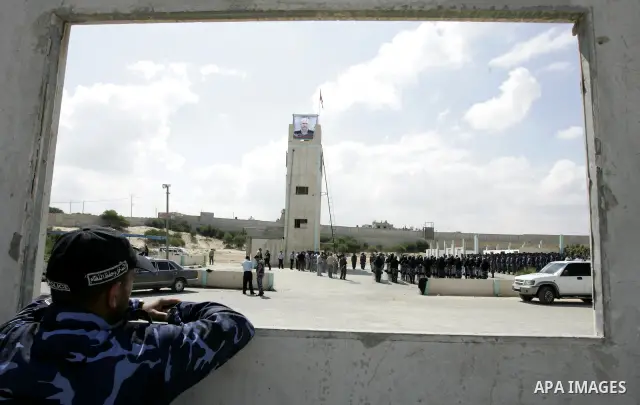 Palestinian member of the Hamas security forces look at the security forces, Hamas during their graduation ceremony in the southern Gaza Strip town of Khan Yunis on 02 June 2011. The release of the captured soldier Versu...