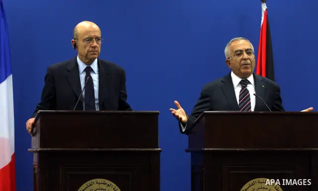 Palestinian Prime Minister, Salam Fayyad and France's Foreign Minister, Alain Juppe during a press conference in the West Bank city of Ramallah on June 2, 2011. as Juppe announced France is ready to host a Middle East pe...