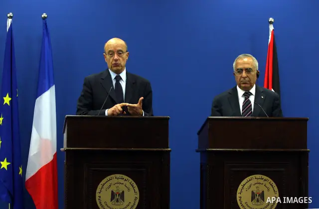 Palestinian Prime Minister, Salam Fayyad and France's Foreign Minister, Alain Juppe during a press conference in the West Bank city of Ramallah on June 2, 2011. as Juppe announced France is ready to host a Middle East pe...