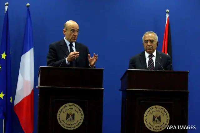 Palestinian Prime Minister, Salam Fayyad and France's Foreign Minister, Alain Juppe during a press conference in the West Bank city of Ramallah on June 2, 2011. as Juppe announced France is ready to host a Middle East pe...
