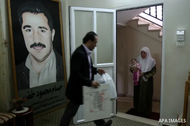 A Palestinian woman stands inside a room following a raid at her house by Israeli army forces after arrested ,Hussam Khader , militants of the Fatah Chairman of the Committee to Defend Refugee Rights in the West Bank in...