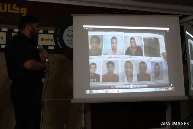 A Palestinian policeman from the Islamic Hamas movement displays a video for confiscated drugs and drug addicts and dealers in Gaza City on June 3, 2011, following a military operation. Drug use was once rare in Gaza's c...