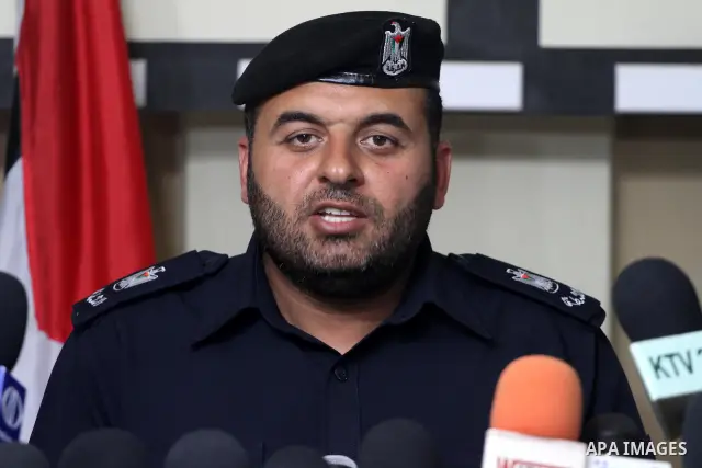 A Palestinian policeman from the Islamic Hamas movement displays a video for confiscated drugs and drug addicts and dealers in Gaza City on June 3, 2011, following a military operation. Drug use was once rare in Gaza's c...
