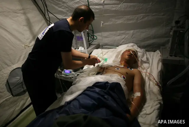 Wounded Libyan rebels were put under medical surveillance at a temporary Intensive Care Unit set up on a ship evacuating injured residents and stranded foreign refugees from the city of Misrata to Benghazi, in the Medite...