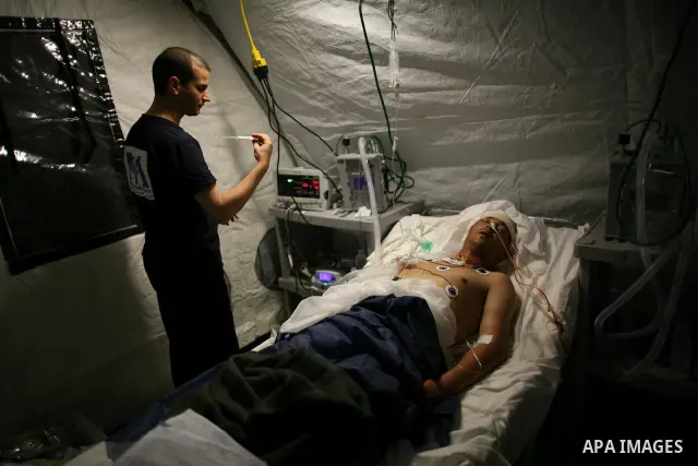 Wounded Libyan rebels were put under medical surveillance at a temporary Intensive Care Unit set up on a ship evacuating injured residents and stranded foreign refugees from the city of Misrata to Benghazi, in the Medite...