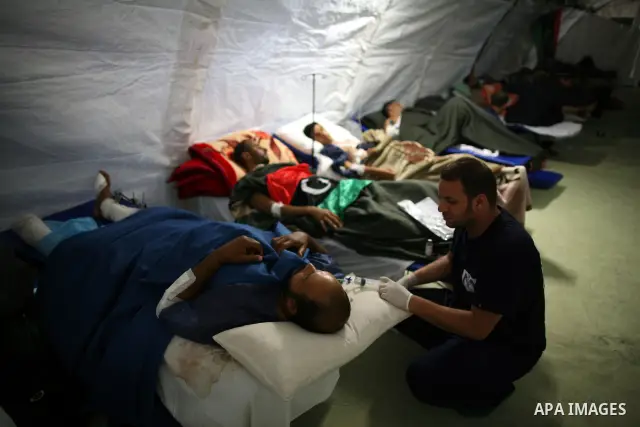 Wounded Libyan rebels were put under medical surveillance at a temporary Intensive Care Unit set up on a ship evacuating injured residents and stranded foreign refugees from the city of Misrata to Benghazi, in the Medite...