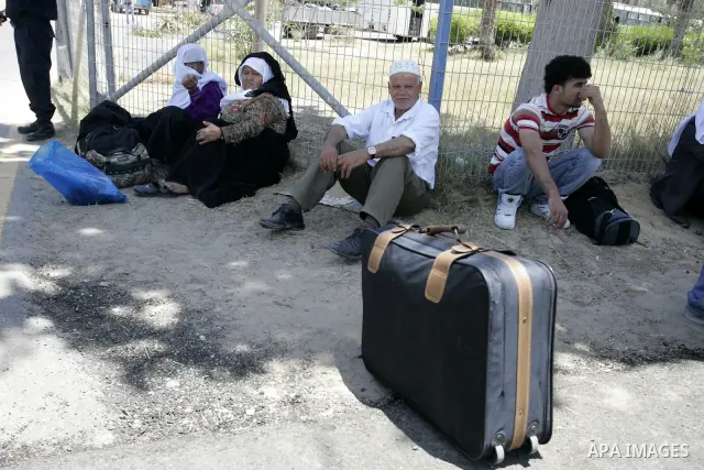 Palestinians wanting to cross into Egypt through the Rafah border crossing are stopped on June 4, 2011, as Egyptian officials at the border with Gaza barred Palestinians from crossing, but later allowed them passage out...