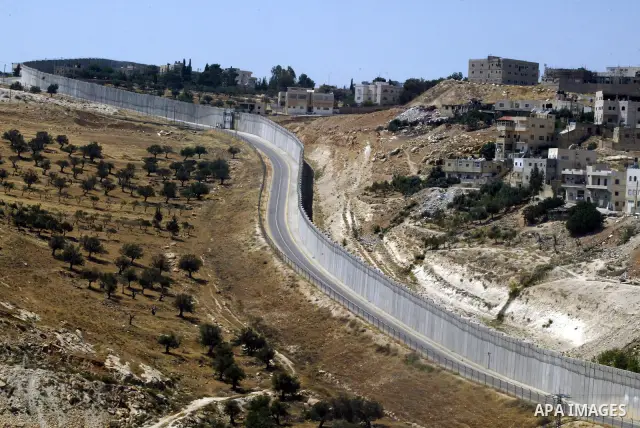 A view for a part of Israel's controversial separation barrier in the West Bank town of Abu Dis on June 4,2011. Israel says the projected 723 kilometres (454 miles) of steel and concrete walls, fences and barbed wire are...