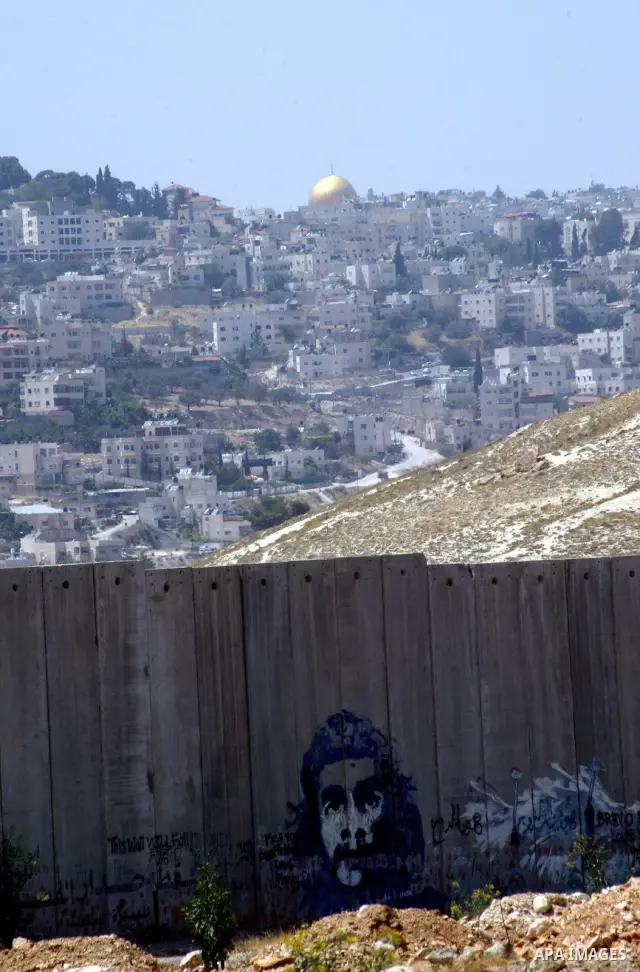 A view for a part of Israel's controversial separation barrier in the West Bank town of Abu Dis on June 4,2011. Israel says the projected 723 kilometres (454 miles) of steel and concrete walls, fences and barbed wire are...