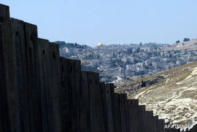 A view for a part of Israel's controversial separation barrier in the West Bank town of Abu Dis on June 4,2011. Israel says the projected 723 kilometres (454 miles) of steel and concrete walls, fences and barbed wire are...