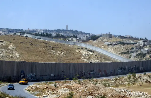A view for a part of Israel's controversial separation barrier in the West Bank town of Abu Dis on June 4,2011. Israel says the projected 723 kilometres (454 miles) of steel and concrete walls, fences and barbed wire are...