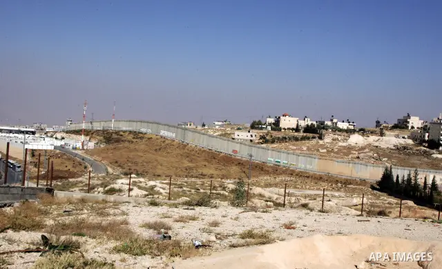 A view for a part of Israel's controversial separation barrier in the West Bank town of Abu Dis on June 4,2011. Israel says the projected 723 kilometres (454 miles) of steel and concrete walls, fences and barbed wire are...