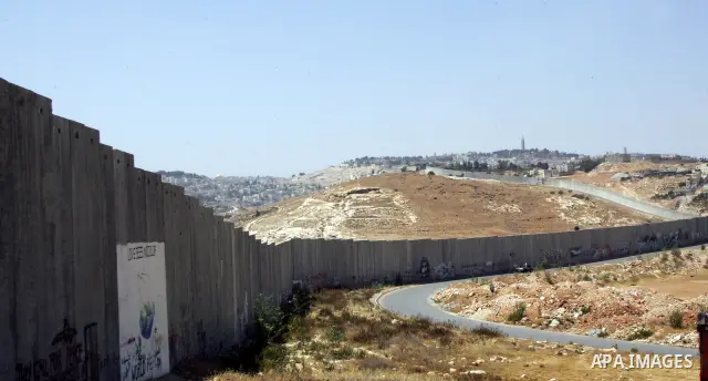 A view for a part of Israel's controversial separation barrier in the West Bank town of Abu Dis on June 4,2011. Israel says the projected 723 kilometres (454 miles) of steel and concrete walls, fences and barbed wire are...