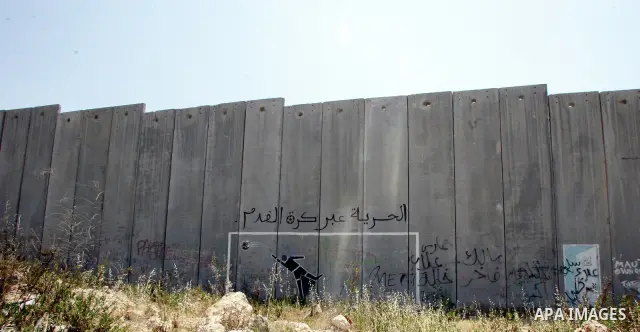 A view for a part of Israel's controversial separation barrier in the West Bank town of Abu Dis on June 4,2011. Israel says the projected 723 kilometres (454 miles) of steel and concrete walls, fences and barbed wire are...