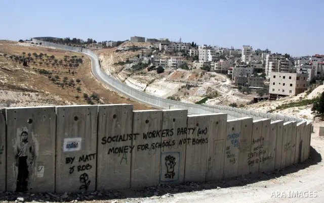 A view for a part of Israel's controversial separation barrier in the West Bank town of Abu Dis on June 4,2011. Israel says the projected 723 kilometres (454 miles) of steel and concrete walls, fences and barbed wire are...