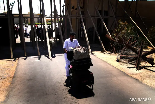 Egyptian soldiers help Palestinian passengers at the Rafah border crossing in the southern Gaza Strip 04 June 2011. Egyptian authorities reopened its Rafah border crossing with the Gaza Strip after a temporary closure wh...