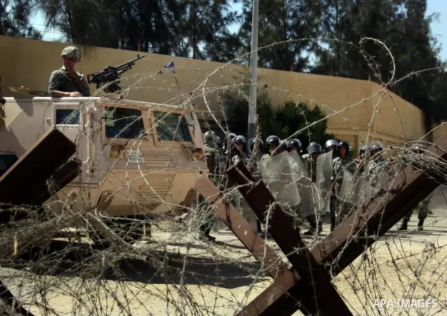 Egyptian soldiers help Palestinian passengers at the Rafah border crossing in the southern Gaza Strip 04 June 2011. Egyptian authorities reopened its Rafah border crossing with the Gaza Strip after a temporary closure wh...
