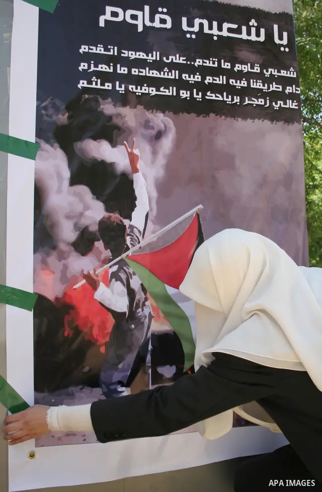 Palestinian Hamas supporters organize a photo gallery for practices of Israeli occupation soldiers and the 44th anniversary of 'Naksa,' Arabic for setback, during a protest in the West Bank city of Hebron on June 05, 201...