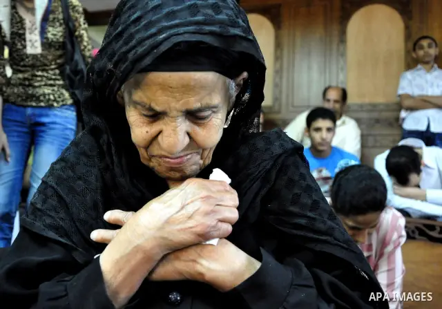 Egyptian Coptic Christians attend Sunday mass at the Virgin Mary church in the Imbaba district of the Egyptian capital of Cairo on June 5, 2011 following the church's restoration after it was burnt during clashes between...
