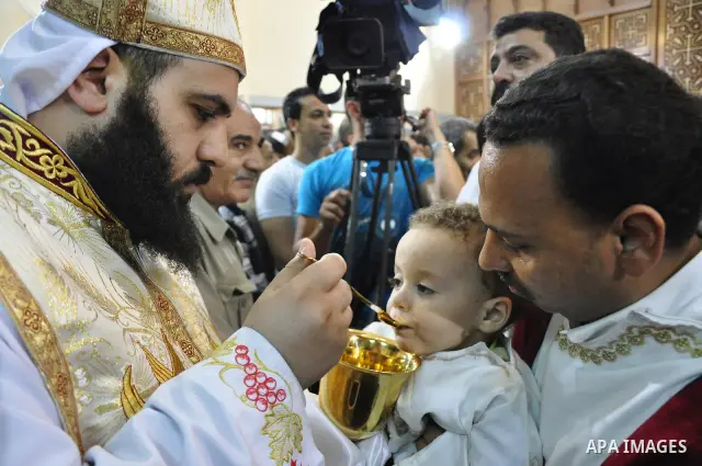 Egyptian Coptic Christian clerics lead Sunday mass at the Virgin Mary church in the Imbaba district of the Egyptian capital of Cairo on June 5, 2011 following the church's restoration after it was burnt during clashes be...