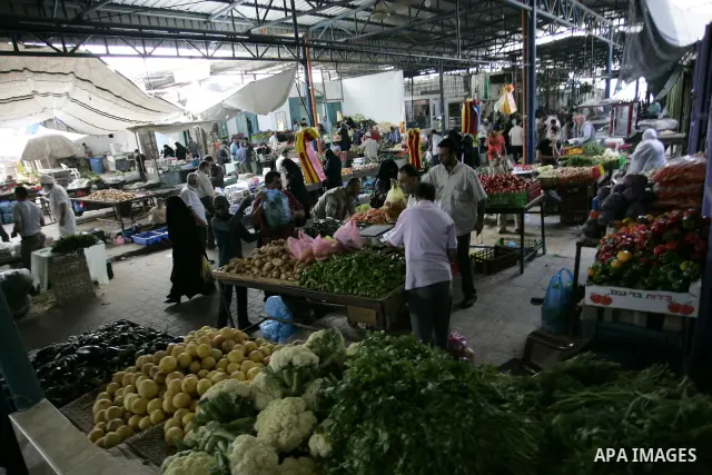 Palestinians during shopping fresh vegetables at a market in Rafah refugee camp in the southern Gaza Strip on June 6, 2011. Photo by Abed Rahim Khatib