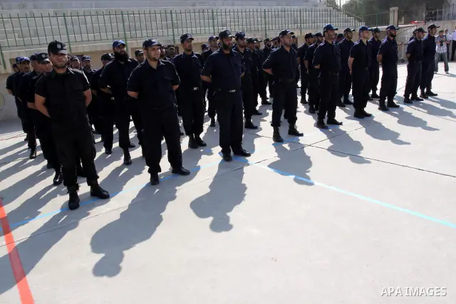 Palestinian Hamas officers and noncommissioned officers stand at attention to meet the new Director General of the Palestinian police Tayseer Al Batesh in Gaza city on June 7, 2011. Photo by Mohammed Asad