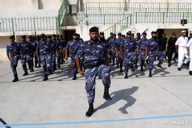 Palestinian Hamas officers and noncommissioned officers stand at attention to meet the new Director General of the Palestinian police Tayseer Al Batesh in Gaza city on June 7, 2011. Photo by Mohammed Asad