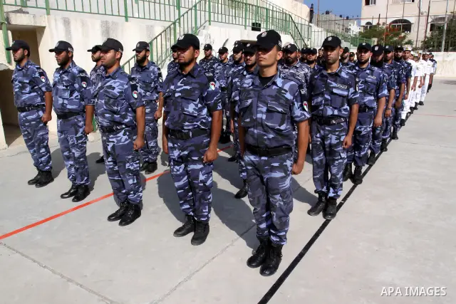 Palestinian Hamas officers and noncommissioned officers stand at attention to meet the new Director General of the Palestinian police Tayseer Al Batesh in Gaza city on June 7, 2011. Photo by Mohammed Asad