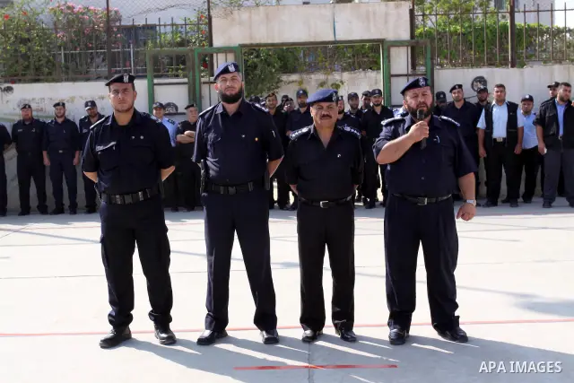 Palestinian Hamas officers and noncommissioned officers stand at attention to meet the new Director General of the Palestinian police Tayseer Al Batesh in Gaza city on June 7, 2011. Photo by Mohammed Asad
