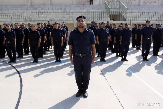 Palestinian Hamas officers and noncommissioned officers stand at attention to meet the new Director General of the Palestinian police Tayseer Al Batesh in Gaza city on June 7, 2011. Photo by Mohammed Asad