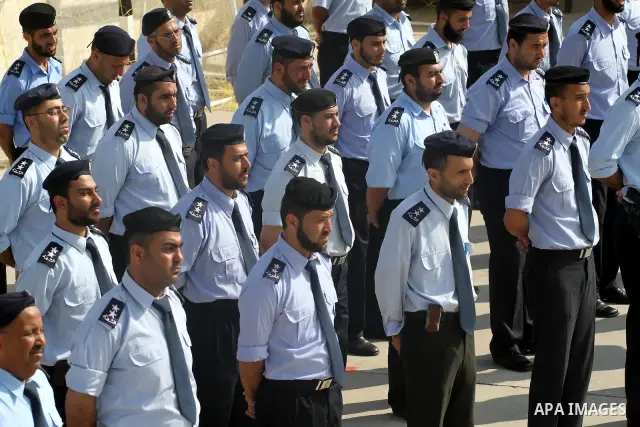 Palestinian Hamas officers and noncommissioned officers stand at attention to meet the new Director General of the Palestinian police Tayseer Al Batesh in Gaza city on June 7, 2011. Photo by Mohammed Asad